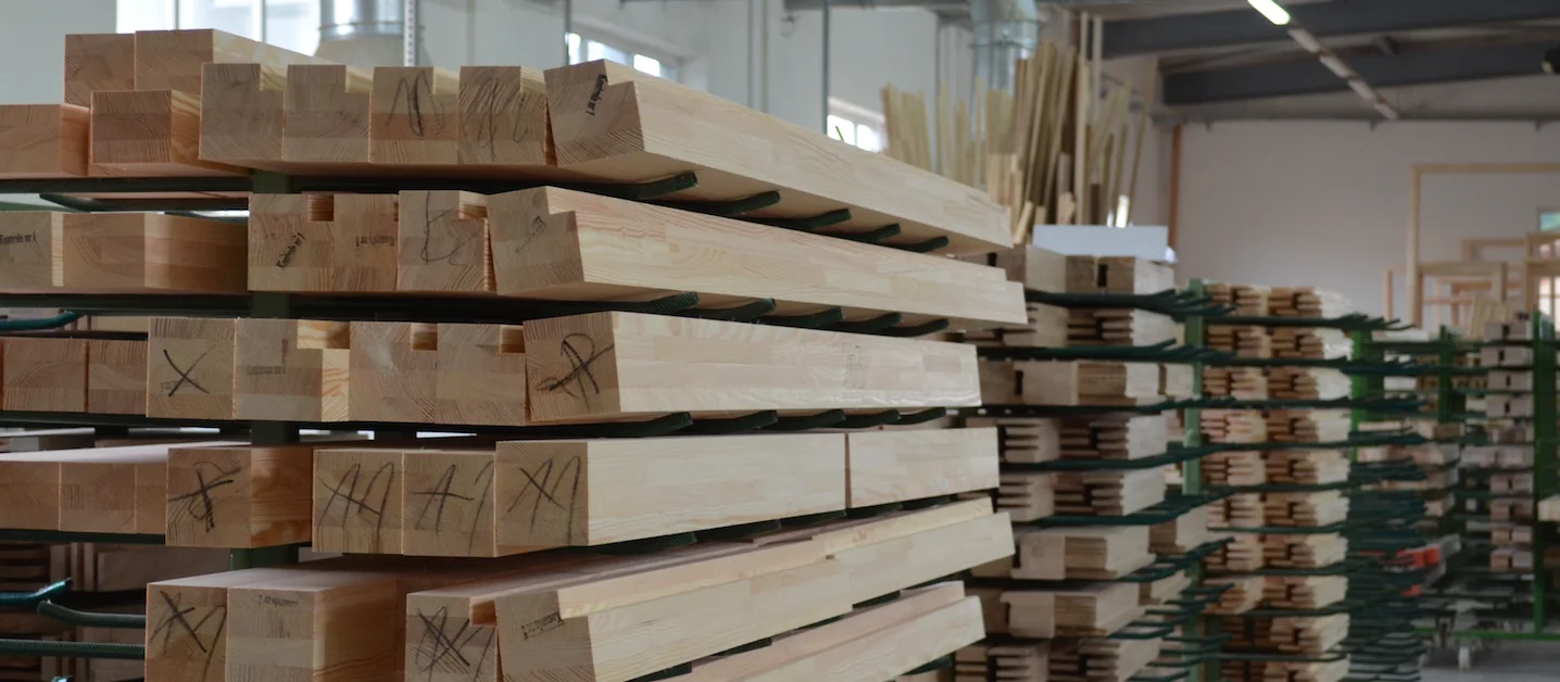 Laminated timber blanks racked in Zola's production facility