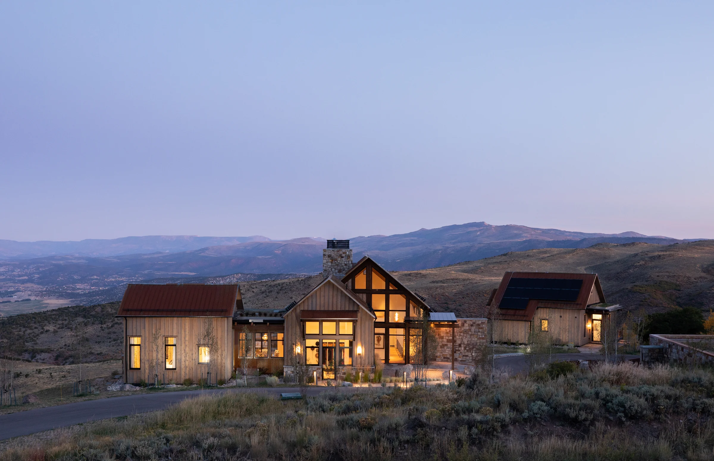 Red Table Ranch — a timber and stone ranch house at dusk in the Colorado high country, Edwards, Colorado