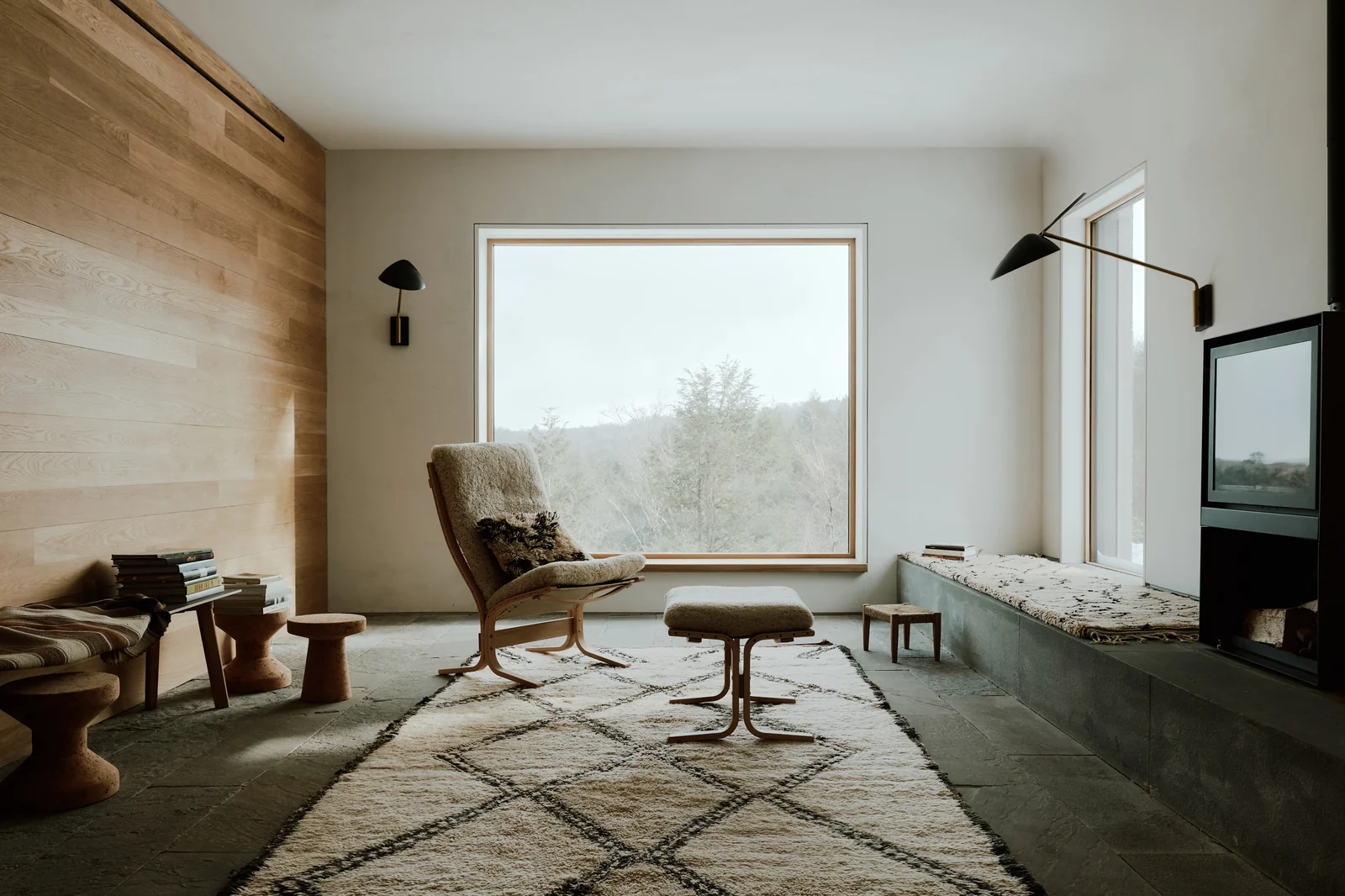 Roscoe Mountain House sitting room — a square Zola picture window onto the woods