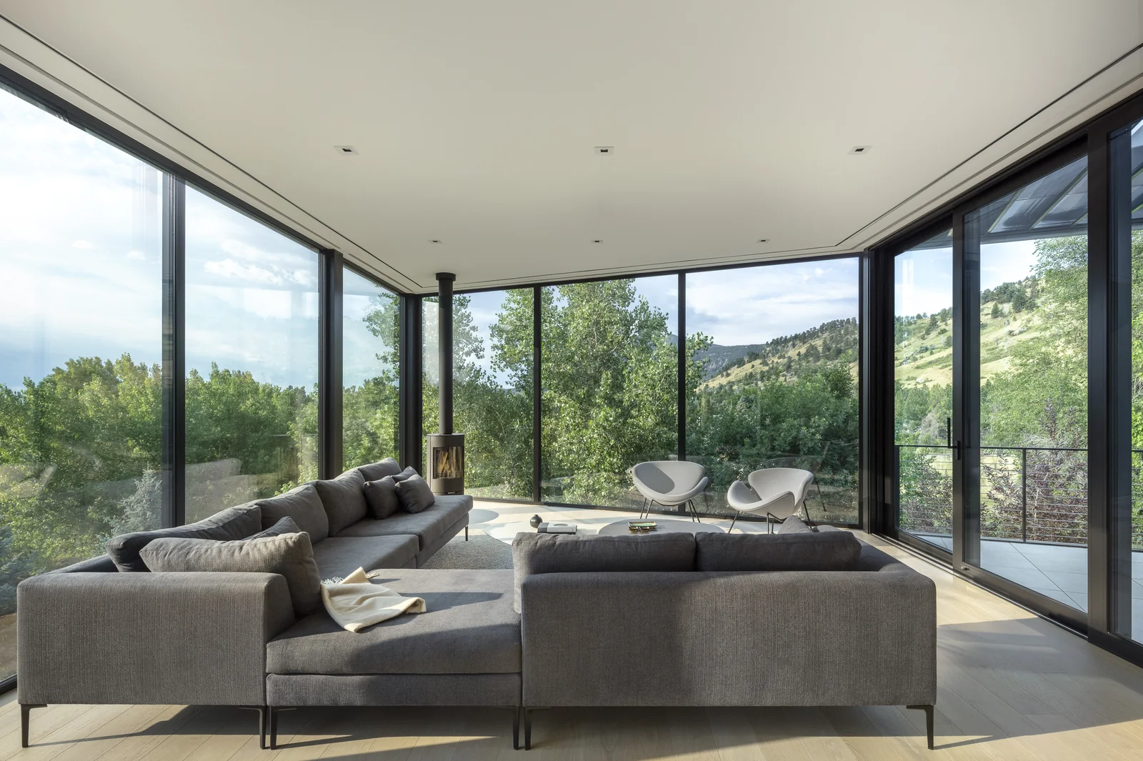 Spring Valley living room — glazed corner looking out to the Boulder foothills